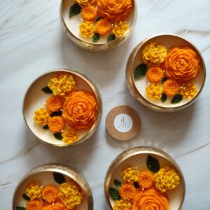 Marigold urli candle with yellow and orange floral design