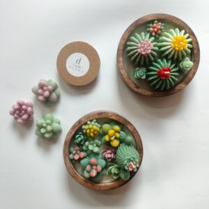 Wooden succulent bowl candle with green succulent and floral design
