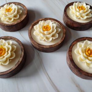 Wooden bowl candle with layered white lotus flower and yellow centre